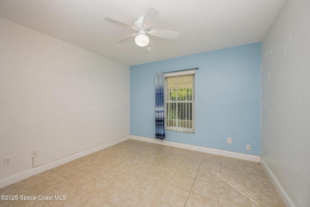 spare room with ceiling fan