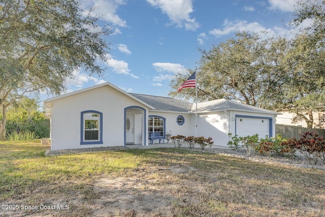 ranch-style house with a front yard and a garage