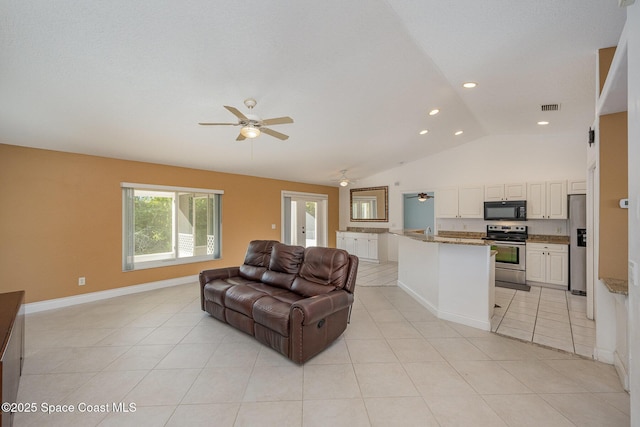 tiled living room featuring vaulted ceiling and ceiling fan