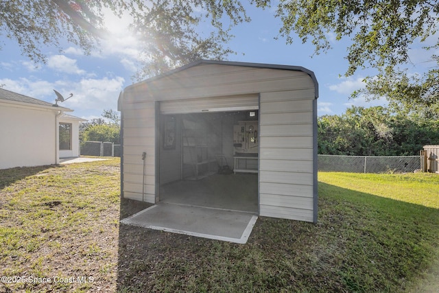 view of outdoor structure with a yard