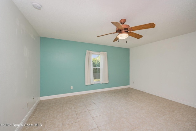 unfurnished room with ceiling fan