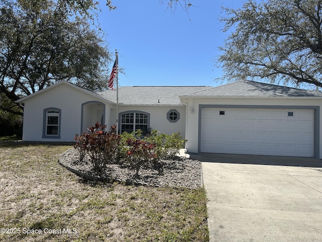 single story home featuring an attached garage, driveway, a shingled roof, and stucco siding