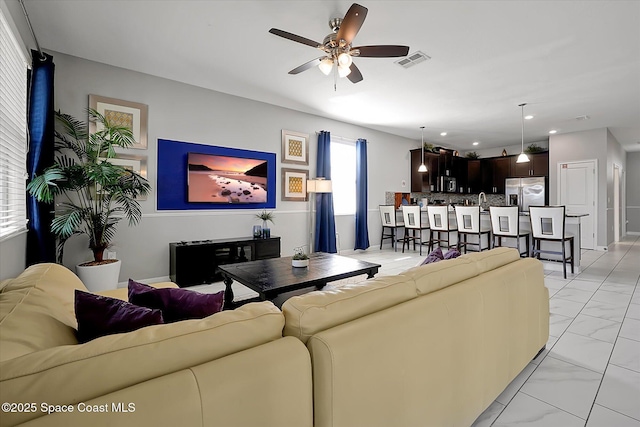 living room with ceiling fan