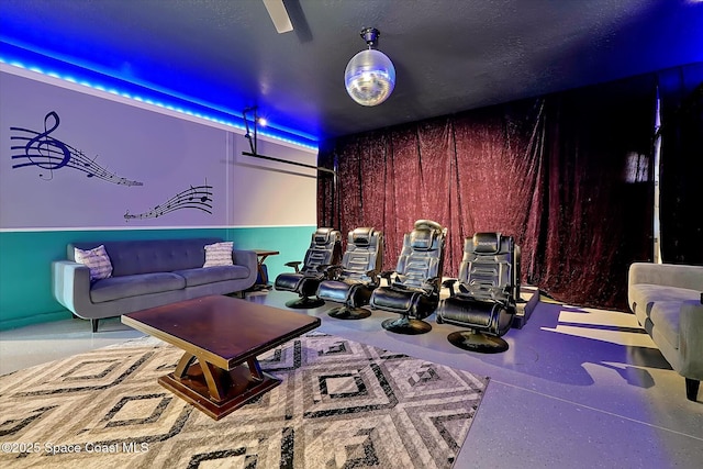 home theater featuring wood walls