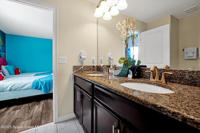 bathroom with tile patterned floors and vanity