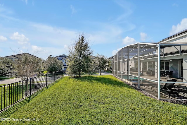 view of yard featuring glass enclosure and a fenced in pool