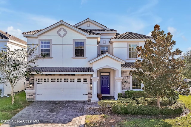 view of front of home with a garage