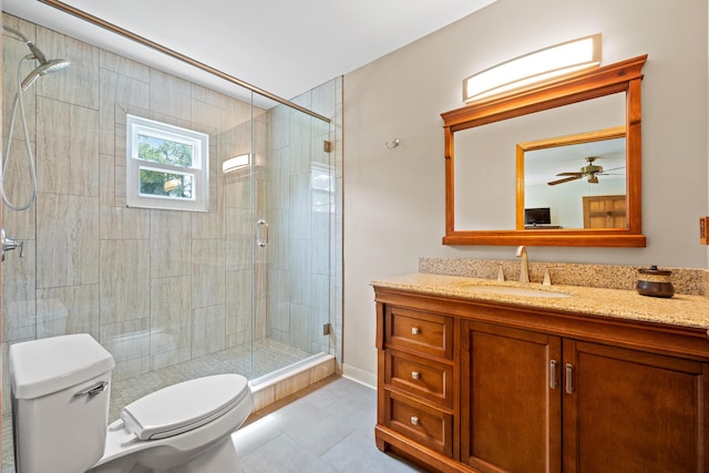 bathroom with tile patterned floors, walk in shower, vanity, ceiling fan, and toilet