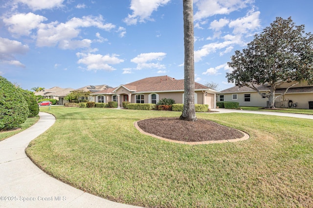 single story home featuring a front lawn