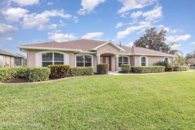 ranch-style home featuring a front lawn