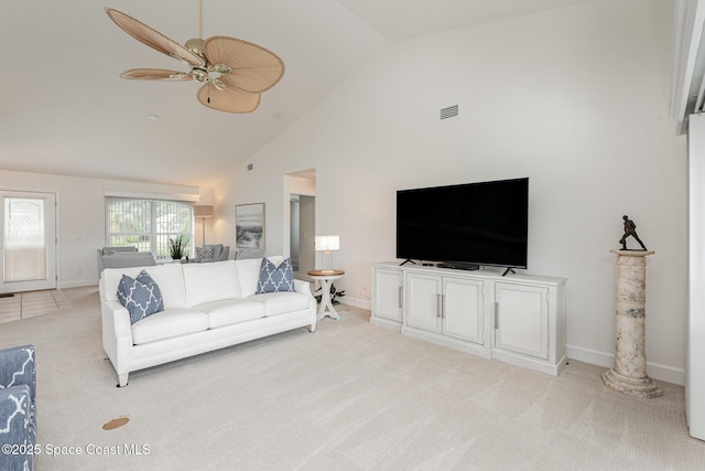 living room with light carpet, high vaulted ceiling, and ceiling fan