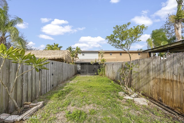 view of yard featuring a sunroom