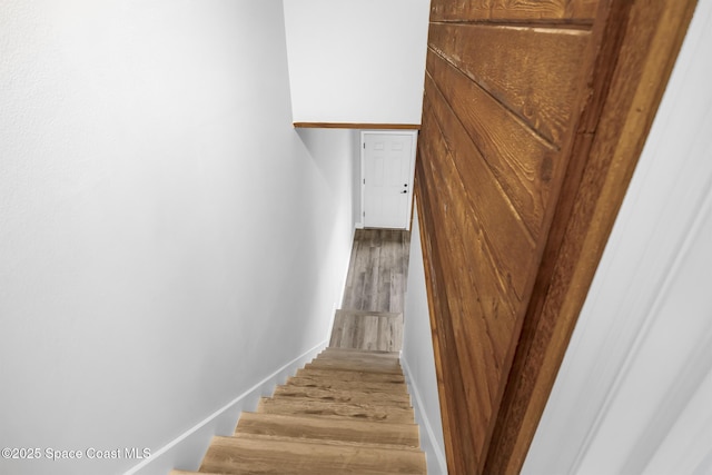 stairway featuring hardwood / wood-style flooring