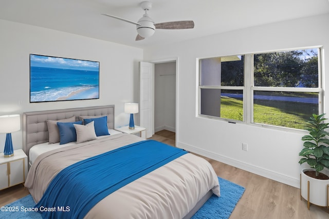 bedroom featuring ceiling fan and light hardwood / wood-style floors