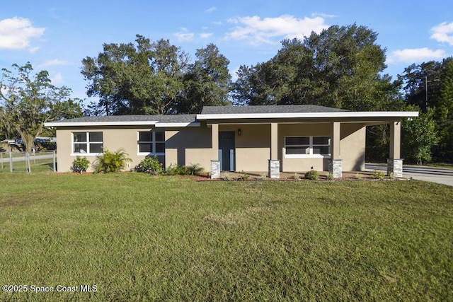 ranch-style house with a carport and a front lawn