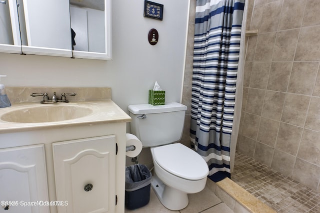 bathroom featuring a shower with shower curtain, vanity, toilet, and tile patterned flooring