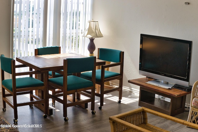 4700 Ocean Beach Blvd Unit 404, Cocoa Beach, FL 32931 - dining area with wood finished floors
