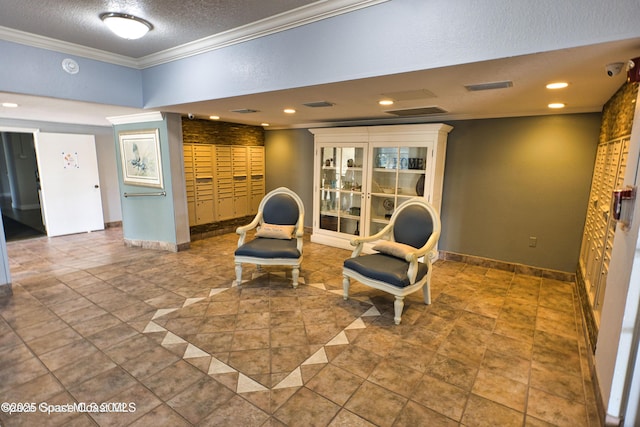 living area with ornamental molding and a textured ceiling