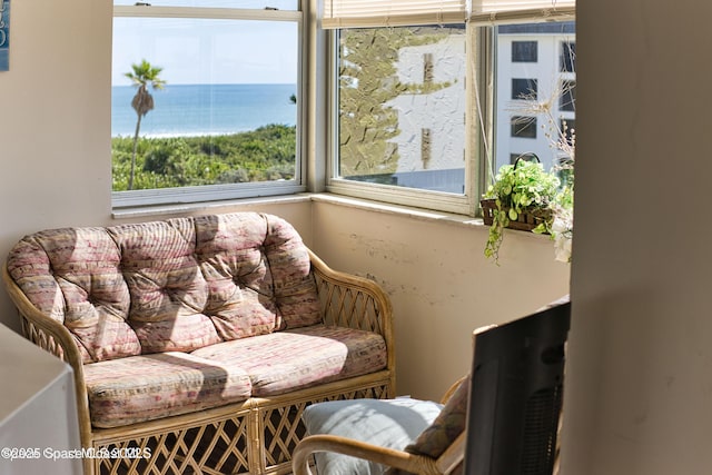 living area featuring a water view