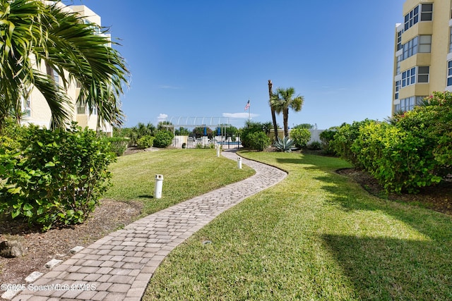 4700 Ocean Beach Blvd Unit 404, Cocoa Beach, FL 32931 - view of home's community with a yard