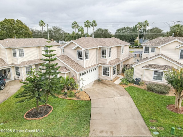 view of front facade with central AC, a front yard, and a garage