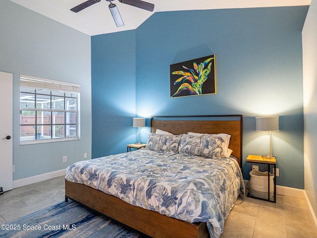 bedroom featuring ceiling fan and lofted ceiling