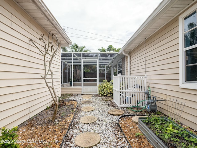 view of yard featuring glass enclosure