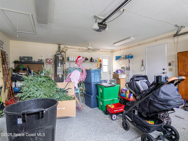 garage with ceiling fan, a garage door opener, and gas water heater