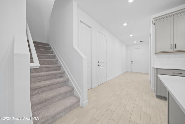 stairway with wood-type flooring