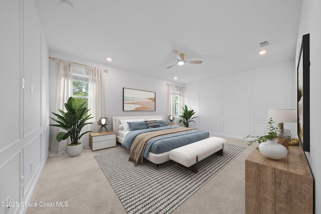 carpeted bedroom with ceiling fan