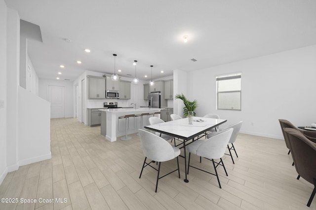 dining room with light hardwood / wood-style floors