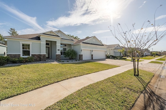 view of front of home featuring a garage and a front yard