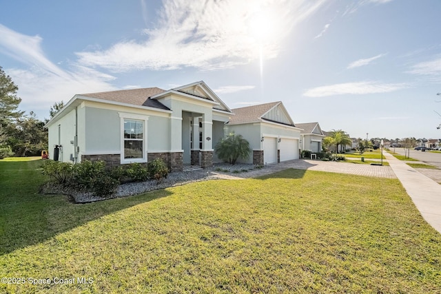 view of front of property with a front lawn and a garage