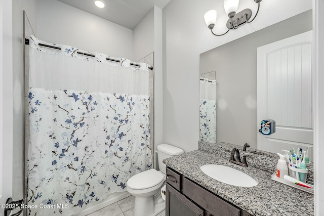 bathroom with a shower with curtain, tile patterned flooring, vanity, and toilet