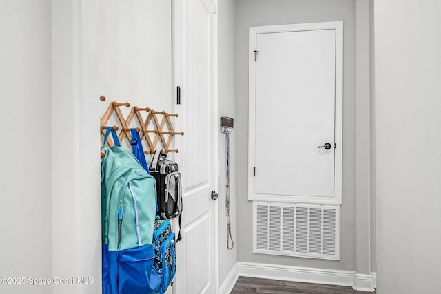 doorway with dark hardwood / wood-style flooring