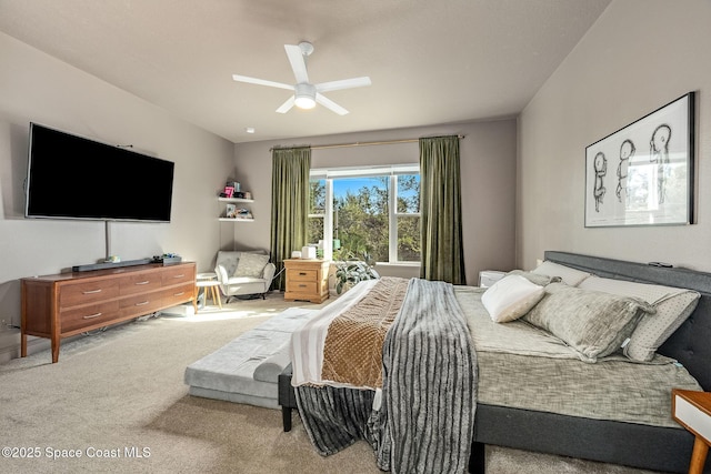 bedroom featuring ceiling fan and carpet