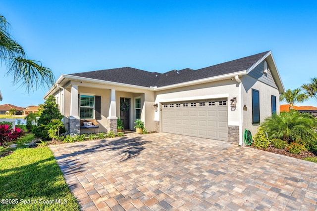 view of front of property featuring covered porch and a garage