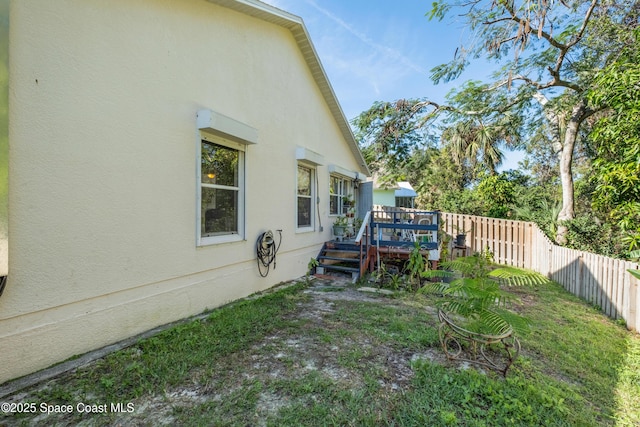 view of yard featuring a wooden deck