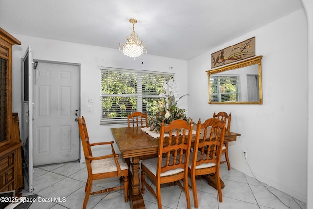 dining area featuring an inviting chandelier