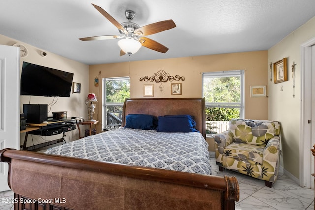 bedroom featuring ceiling fan