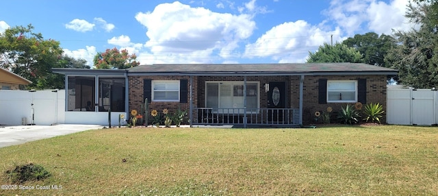 ranch-style house with a porch and a front lawn