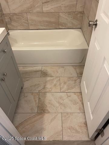 bathroom featuring a bathtub and vanity