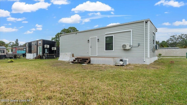 back of property featuring a yard