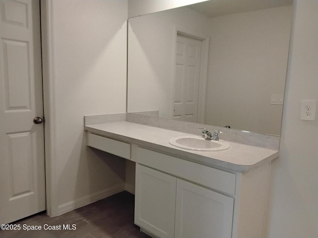 bathroom with vanity and wood-type flooring