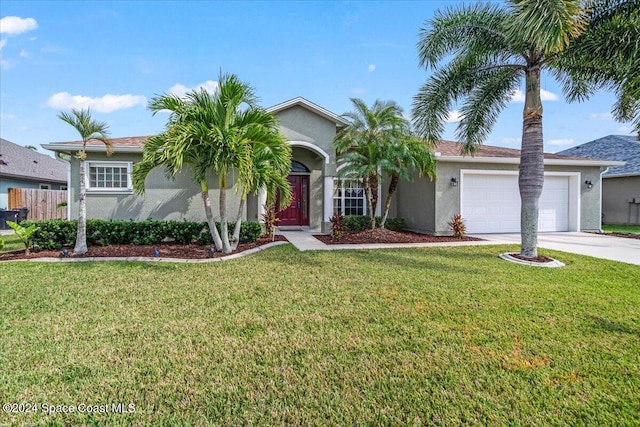 view of front of home featuring a front yard and a garage