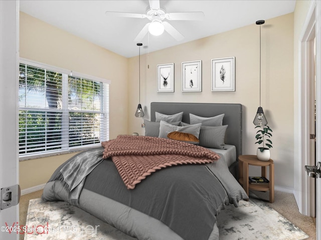 carpeted bedroom featuring ceiling fan