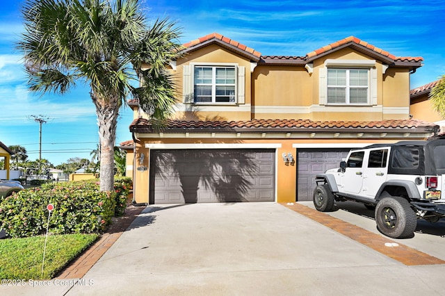 mediterranean / spanish-style house with a garage