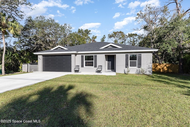 ranch-style home with a front lawn and a garage