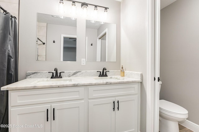 bathroom with a shower with curtain, vanity, and toilet