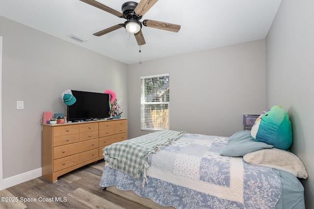 bedroom with ceiling fan and light wood-type flooring